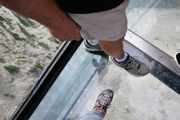 the feet of the two RV Gypsies on the glass bottom floor